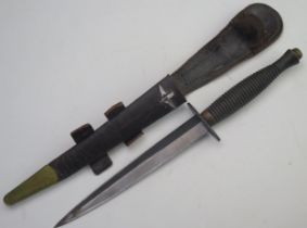 A Fairbairn Sykes third pattern fighting knife with 17.5cm double edged blade, with ribbed grip,