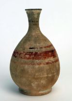 An ancient Cyprian vase, of ovoid form with short flared neck and spout, with banded decoration,