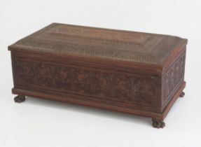 A 19th Century Indian carved sandal wood table top casket, of rectangular outline, with lift off lid