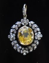 An Antique Yellow Topaz and Rose Cut Diamond Wreath Pendant in a precious yellow and white metal