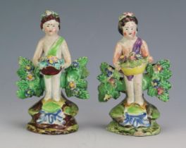 A Walton pearlware figure 'Plenty' standing figure with filled basket, with serrated bocage,