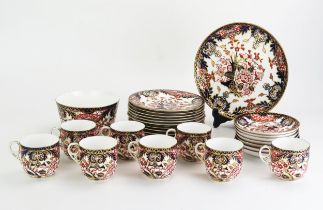 A Royal Crown Derby porcelain part tea service, with floral decoration in the Imari palette,