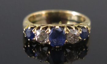 A Sapphire and Old Cut Diamond Five Stone Ring in a precious white metal setting, c. 5x3.9mm