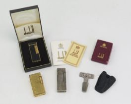 A Dunhill gilt metal and black lacquer Rollagas lighter, cased with instructions and guarantee, a