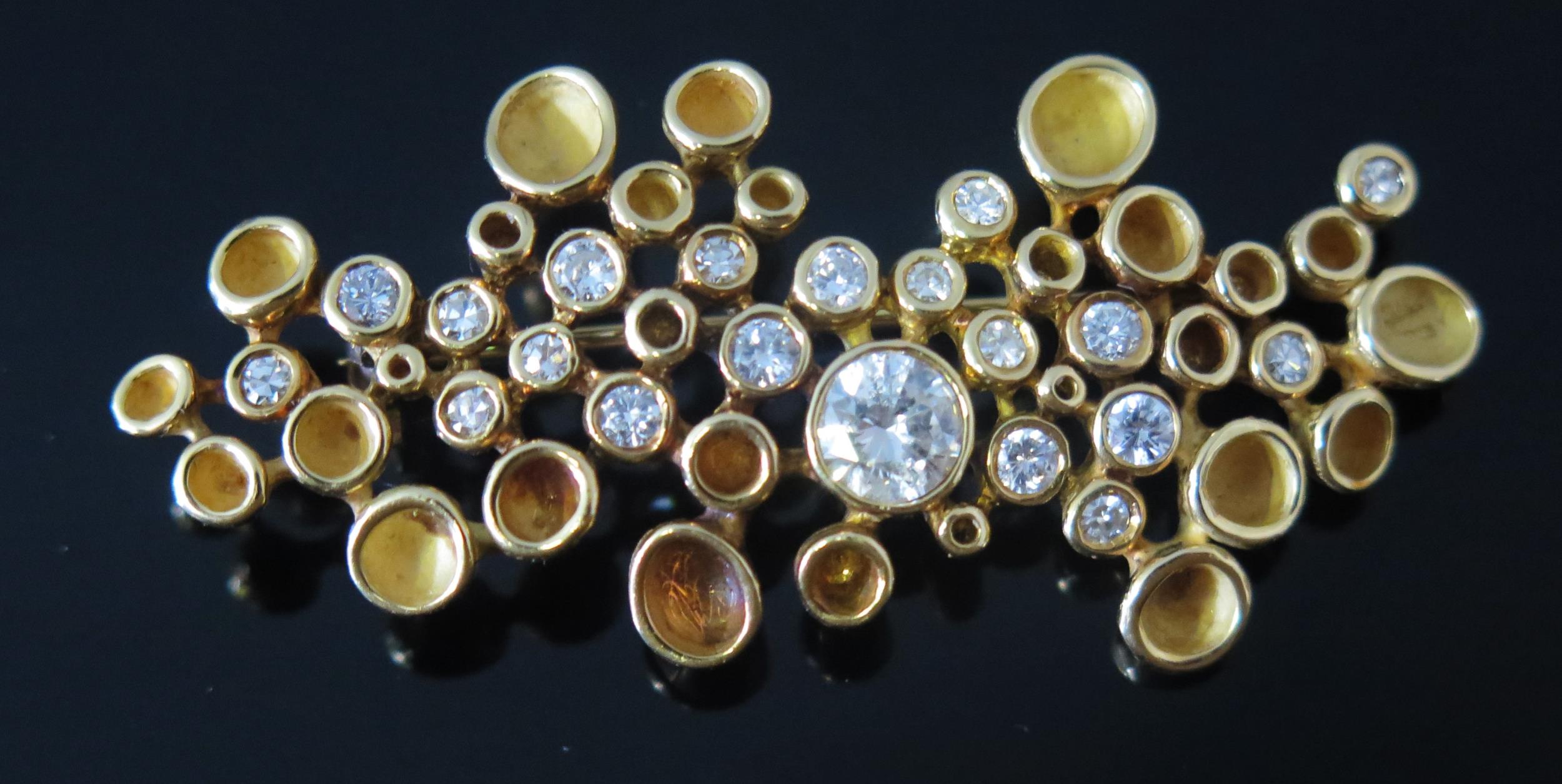 * A Modernist 18ct Gold and Diamond Brooch, c. 5.55mm principal brilliant round cut stone, 53.5mm, - Image 2 of 2