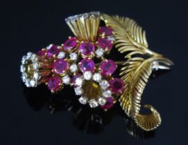 A Ruby and Diamond Foliate Spray Brooch in a precious yellow metal setting, c. 4.3mm largest ruby,