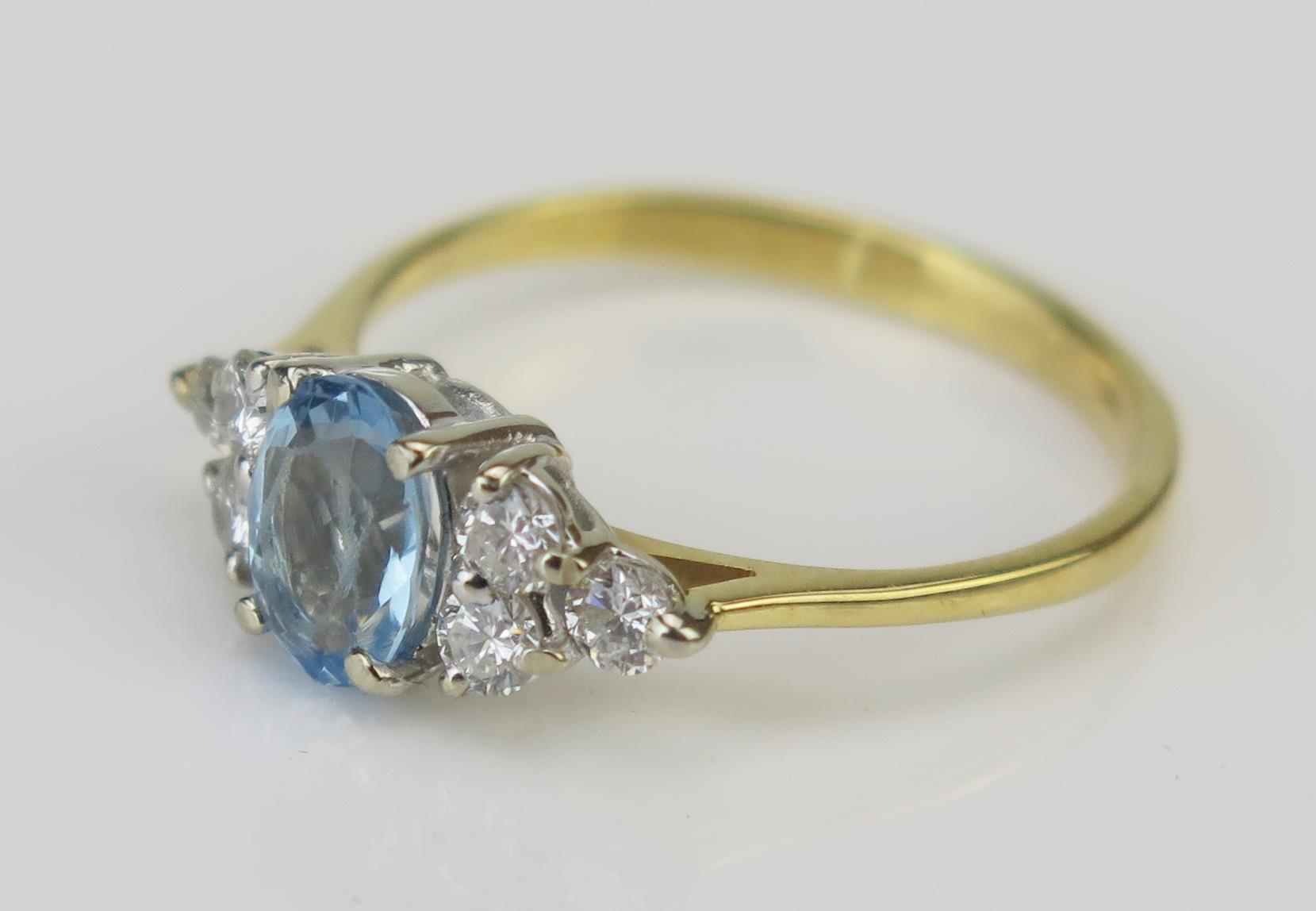 An 18ct Gold, Diamond and Blue Stone Ring, c. 15.7x7mm head, stamped 750 with London import marks, - Image 2 of 2