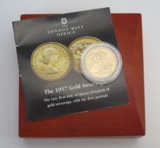 * An Elizabeth II 1957 Gold Sovereign in a later London Mint Office presentation case with