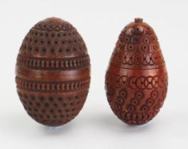 A carved coquilla nut of egg -shaped outline with banded geometric decoration, 7cm long together