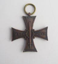 A Polish Cross of Valour medal, impressed no. 50464, lacks ribbon.