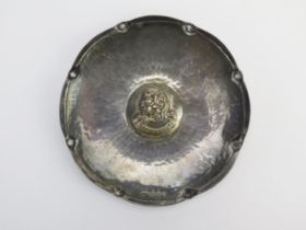 A George V hammered silver regimental dish, maker Alwyn Carr, London, 1935, of circular form the