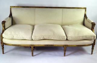 A 19th century Louis XVI style gilt wood canapé, straight top rail and padded back, with padded