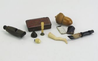 A small amount of collectables including a treen needle case in the form of an acorn, a bone seal in