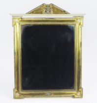 A Royal Presentation gilt metal and metal mounted easel back mirror of arched outline, the