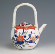 A late 18th/early 19th century Chinese porcelain wine pot and cover, with floral decoration in the