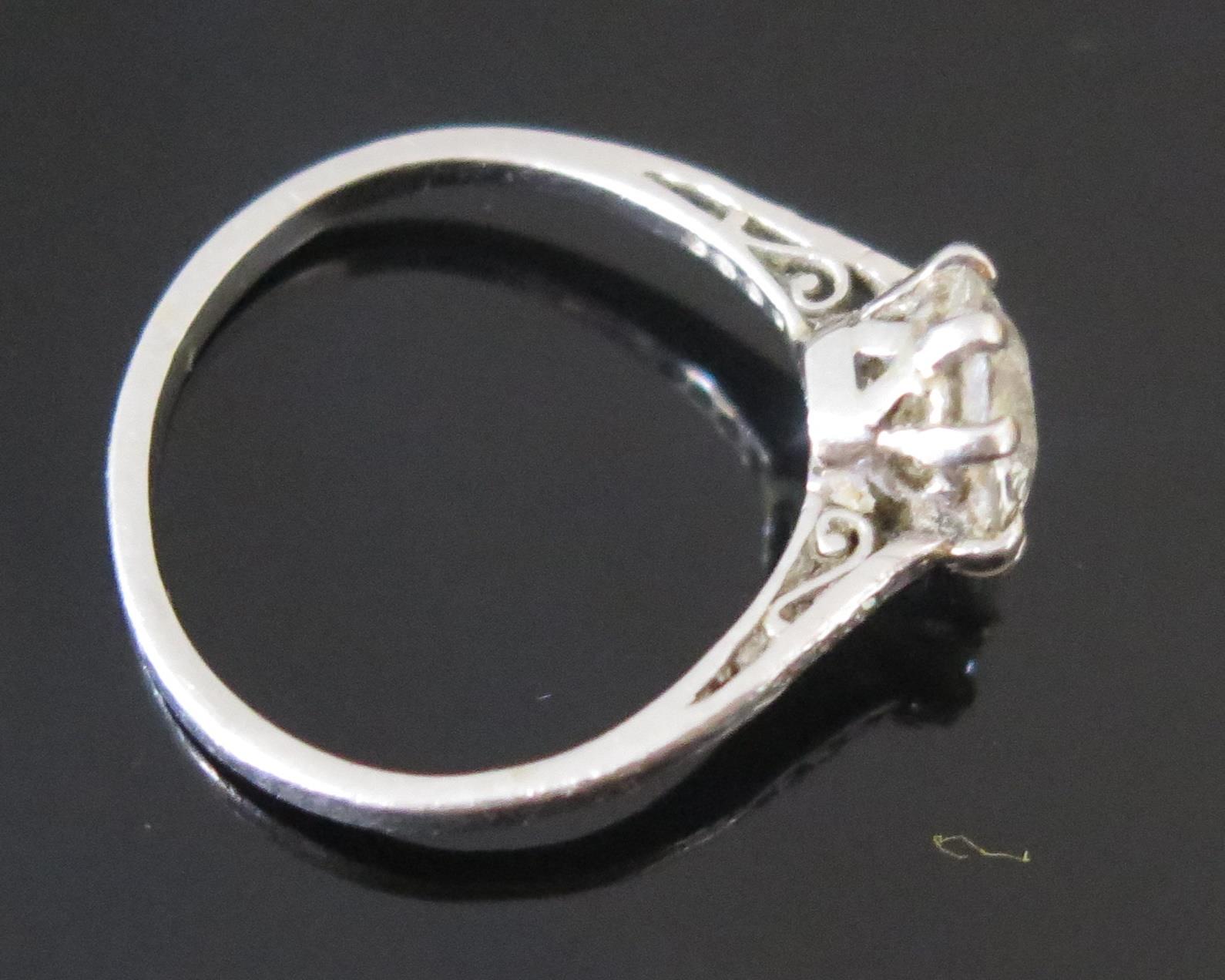 A Diamond Solitaire Ring in a precious white metal setting, the c. 8.1mm old European cut stone in a - Image 3 of 3