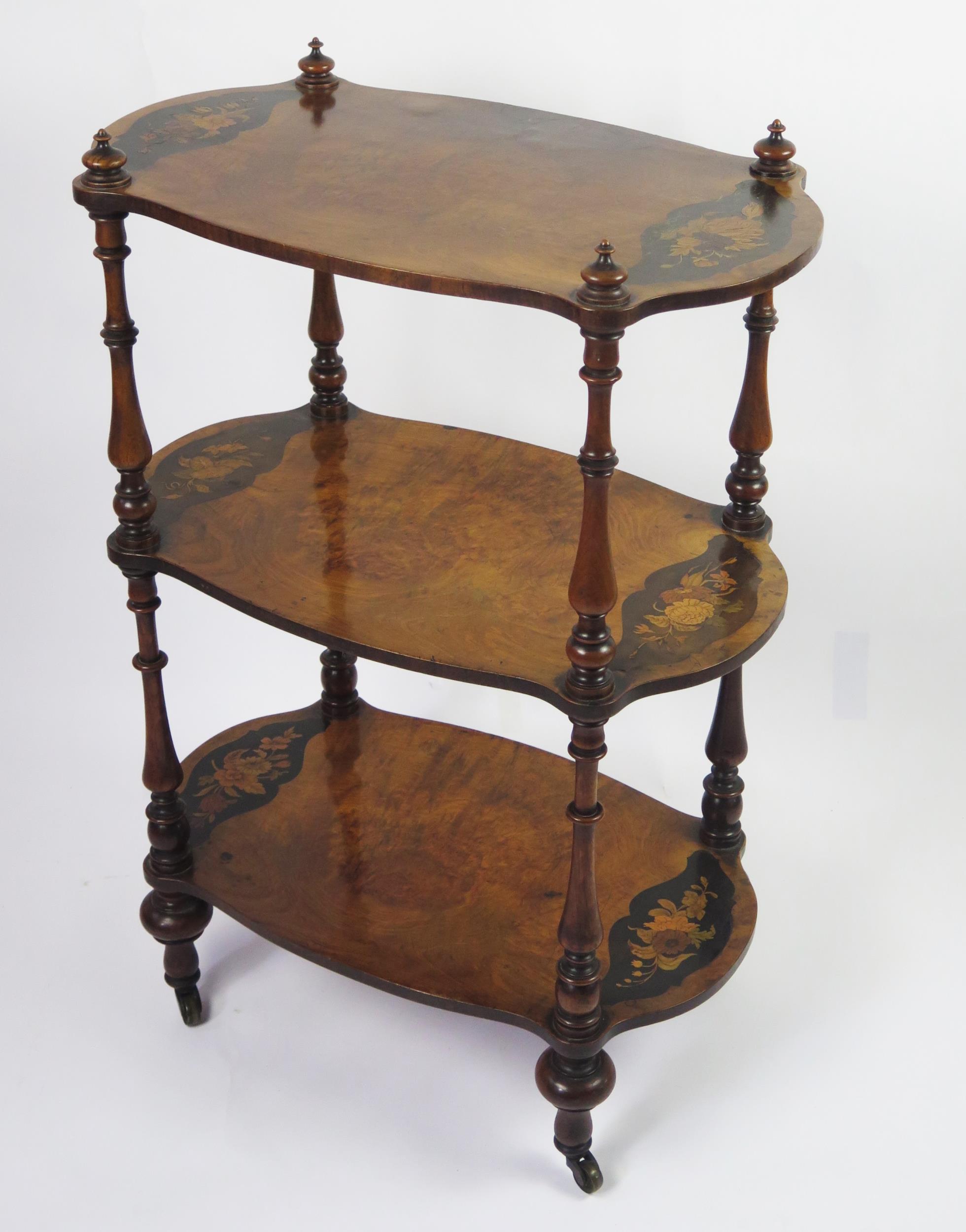 A Victorian walnut and floral inlaid three-tier what not, of cartouche-shaped outline, on ring - Image 2 of 3