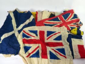 A collection of nautical signalling pennants, contained in a canvas duffel bag.