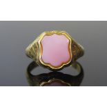 A Victorian 15ct Gold 'Poison' Ring, the hinged top set with agate and opening to reveal a foliate