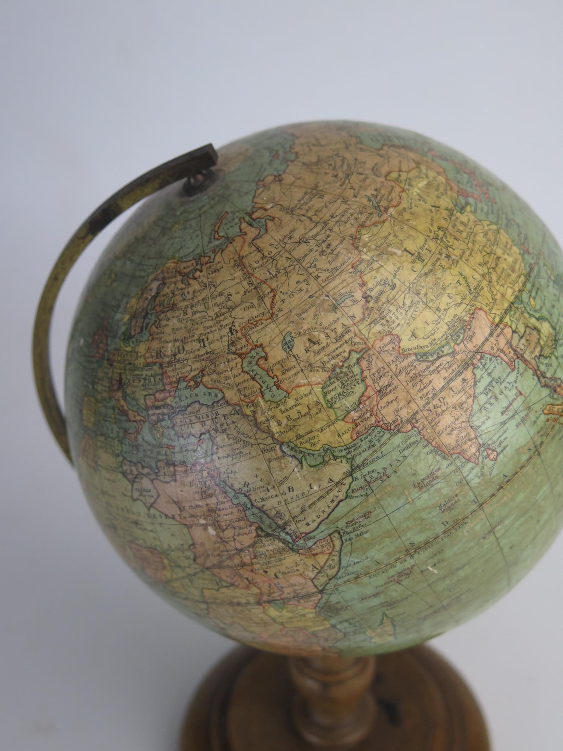 A Johnson's six inch terrestrial globe, on brass frame and turned wood circular base, overall height - Image 4 of 4