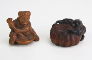 A Japanese carved boxwood netsuke depicting a gourd, signed, 4cm diameter, and another netsuke of