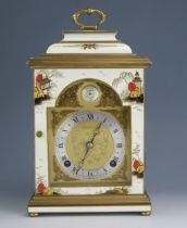 A 20th century bracket clock by Elliot, decorated in the Chinoiserie taste, with domed caddy top