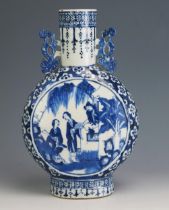 An 18th Century Chinese blue and white moon flask, of traditional design, the central panels