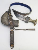 An Indo - Persian jambya, with 19cm curved double edged blade, horn and silver inlaid handle,