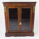 A 19th century walnut, floral inlaid and gilt metal mounted pier cabinet, the rectangular top