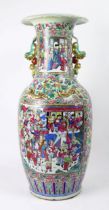 A large 19th century Cantonese famille verte vase, of ovoid form, with flared rim, with handles in