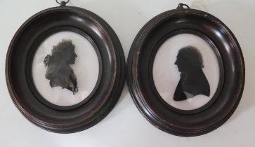 Attributed to Isabella Beetham, two silhouettes reverse painted on glass, of a lady and gentleman,