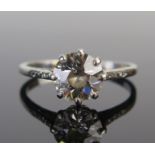 A Diamond Solitaire Ring in a precious white metal setting, the c. 8.1mm old European cut stone in a