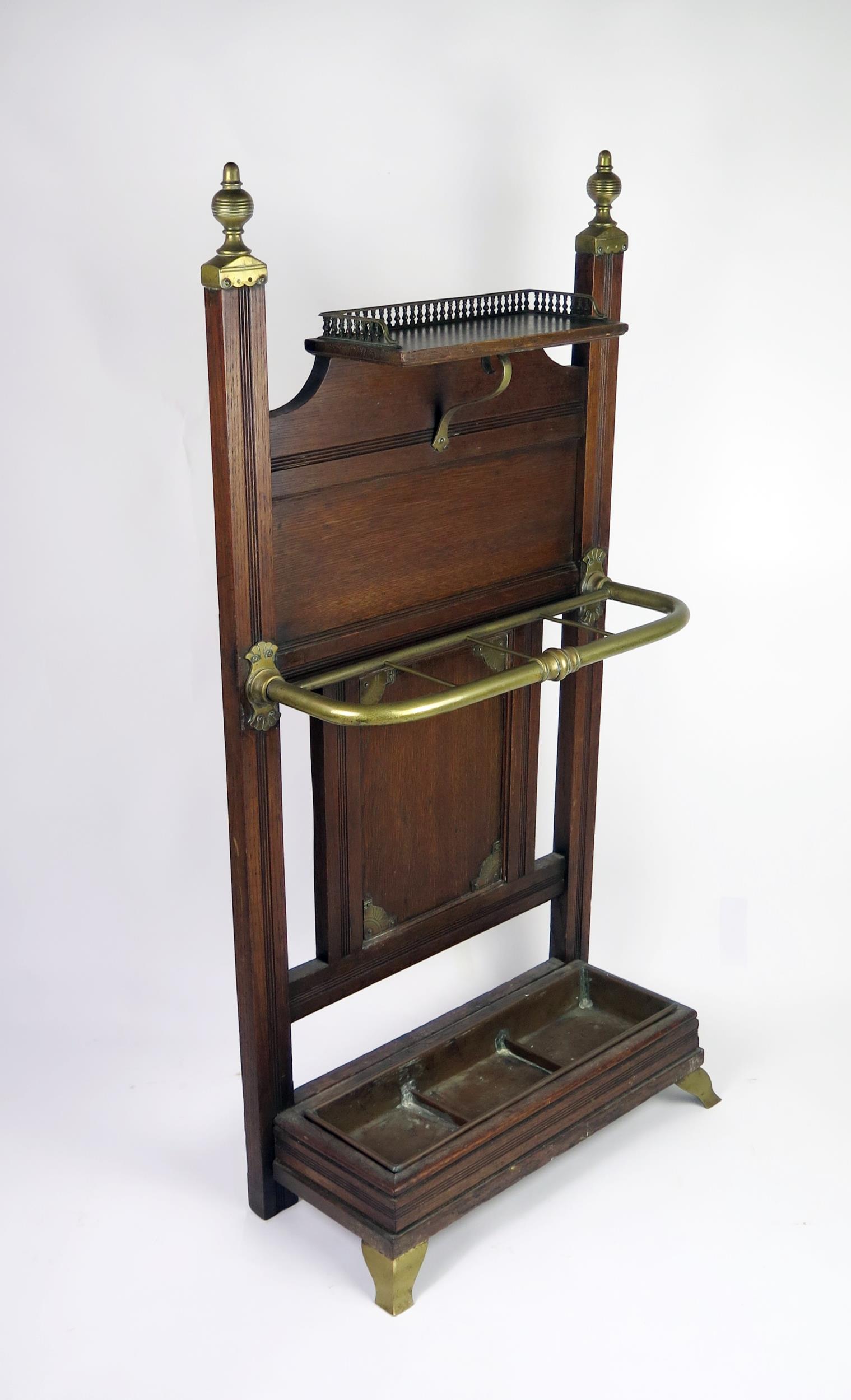 A Victorian Schoolbred style oak stick stand, the rectangular back with brass finials, with single - Image 2 of 2