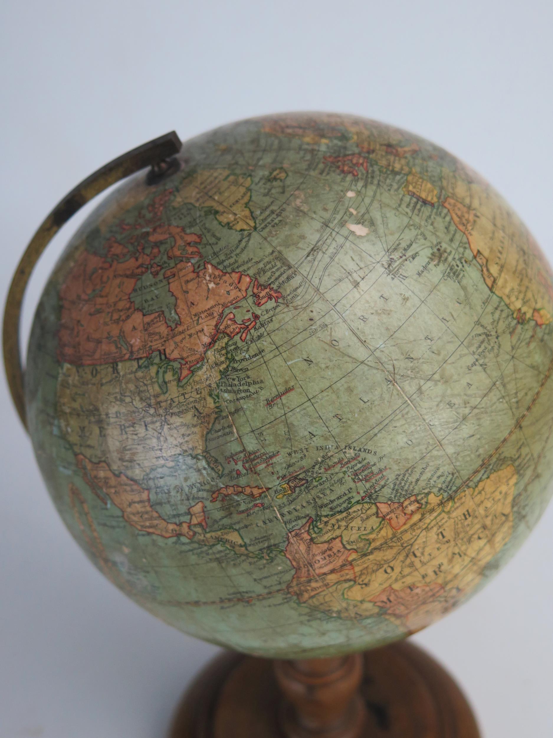 A Johnson's six inch terrestrial globe, on brass frame and turned wood circular base, overall height - Image 3 of 4