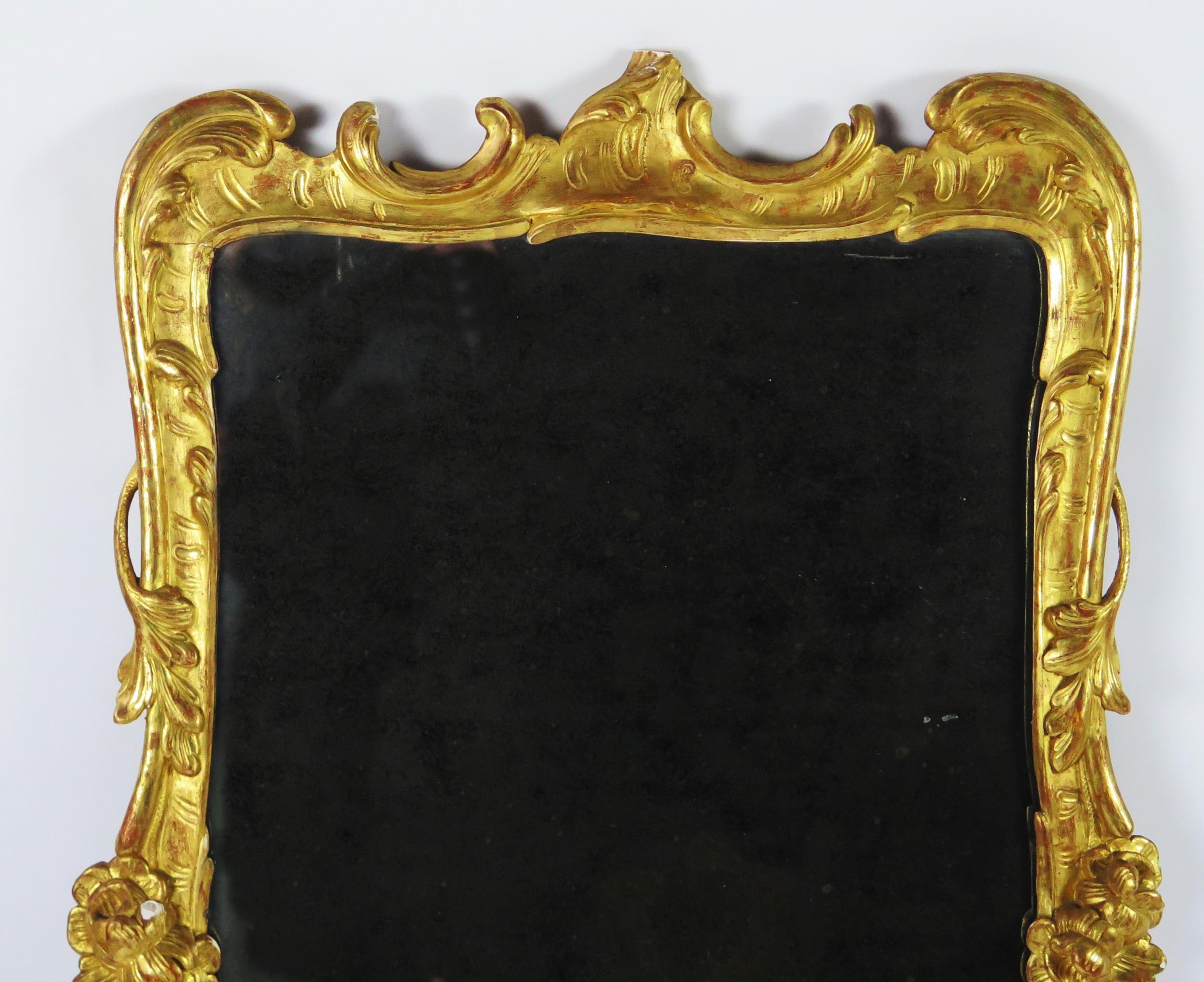 A late 18th century gilt and gesso pier glass, the rectangular mirror plate enclosed by floral and - Image 2 of 3