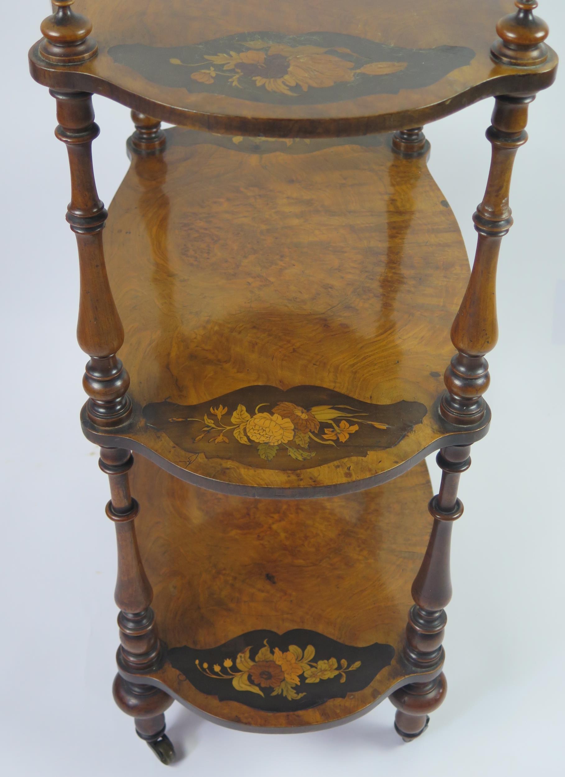 A Victorian walnut and floral inlaid three-tier what not, of cartouche-shaped outline, on ring - Image 3 of 3