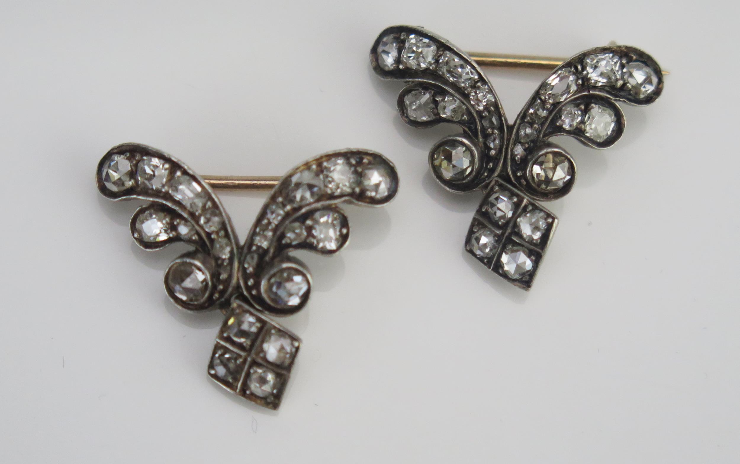 A Pair of 19th Century Diamond Brooches set with old and rose cuts of various shapes and a diamond