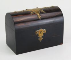 A Victorian coromandel wood and brass mounted casket, of rectangular outline, with domed hinged lid,