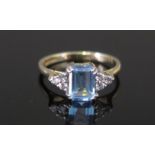 A Modern 9ct Gold, Aqua Marine and White Stone Ring, size J.5, hallmarked, 1.93g