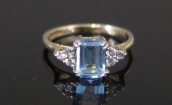 A Modern 9ct Gold, Aqua Marine and White Stone Ring, size J.5, hallmarked, 1.93g