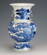 A Chinese blue and white vase of baluster form, decorated with figures in an extensive landscape and