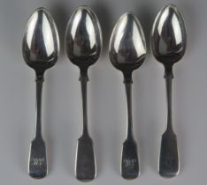 Four assorted silver Fiddle pattern dessert spoons, various makers and dates, crested or initialled,