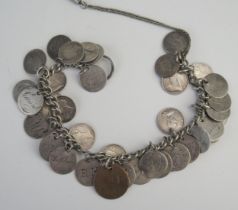 A silver coin bracelet, 22cm long with safety chain, 68gms, 2.20ozs