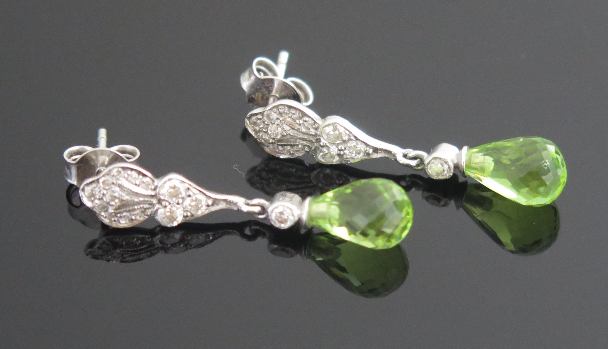 A Pair of 18ct White Gold, Diamond and Peridot? Pendant Earrings, c. 28.9mm drop, 3.29g