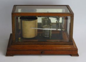 Yeates & Son, Dublin, an oak cased barograph, with seven tier vacuum and single recording arm,