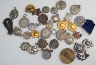 A collection of approx thirty assorted gilt and metal medals and medallions.