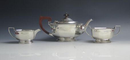 A George VI silver three-piece tea service, maker Adie Brothers Ltd, Chester 1938, of lozenge-shaped