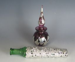 A continental purple glass and silver mounted scent bottle, of globular form with banded floral