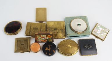 A collection of twelve assorted powder compacts, various shapes and sizes.