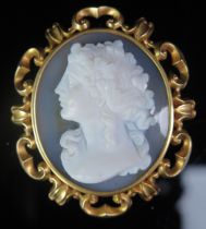 An Antique Hardstone Cameo Brooch decorated with a female bust in profile and in a precious yellow